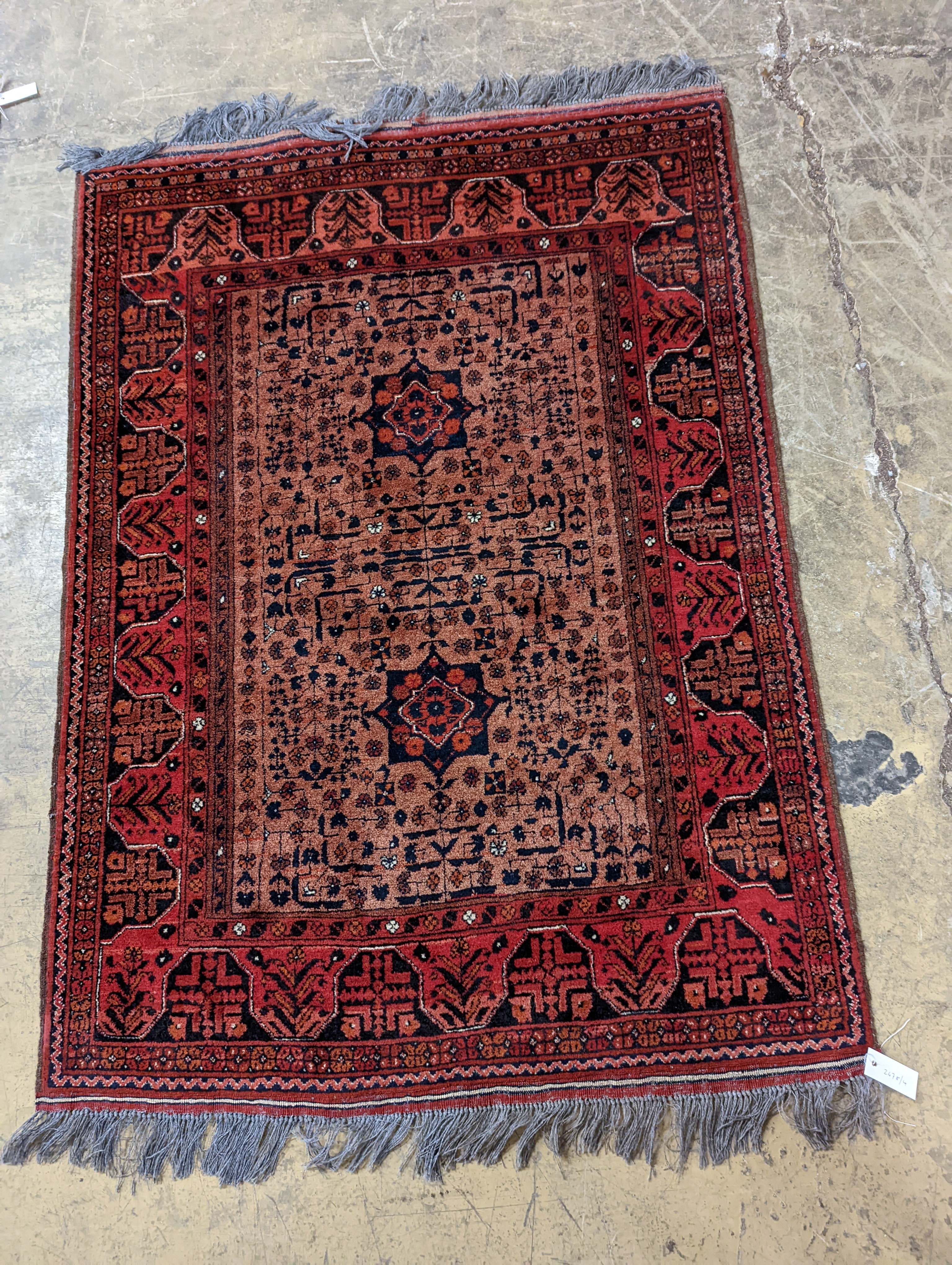 A Belouch red ground rug, 148 x 106cm
